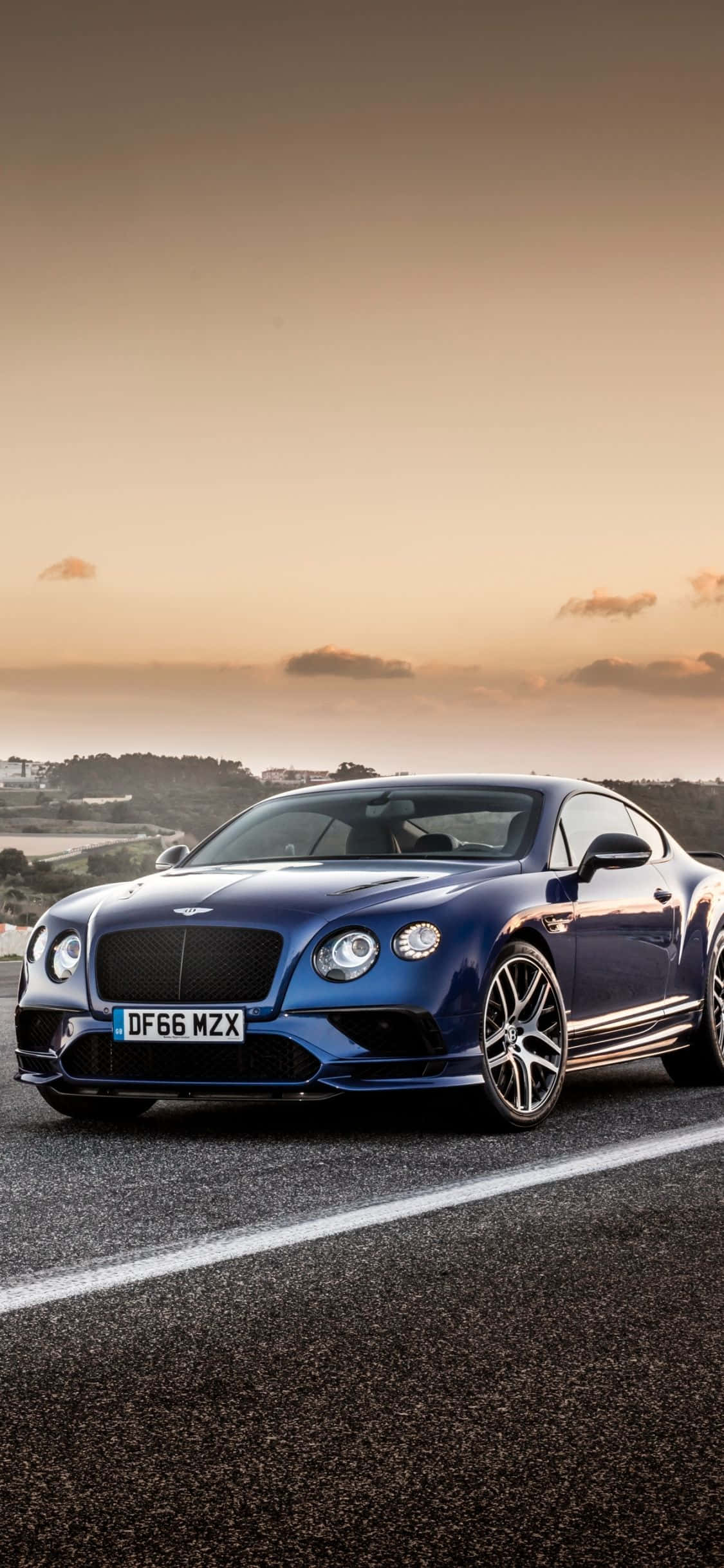 Припаркованный синий Bentley iPhone Шпалери