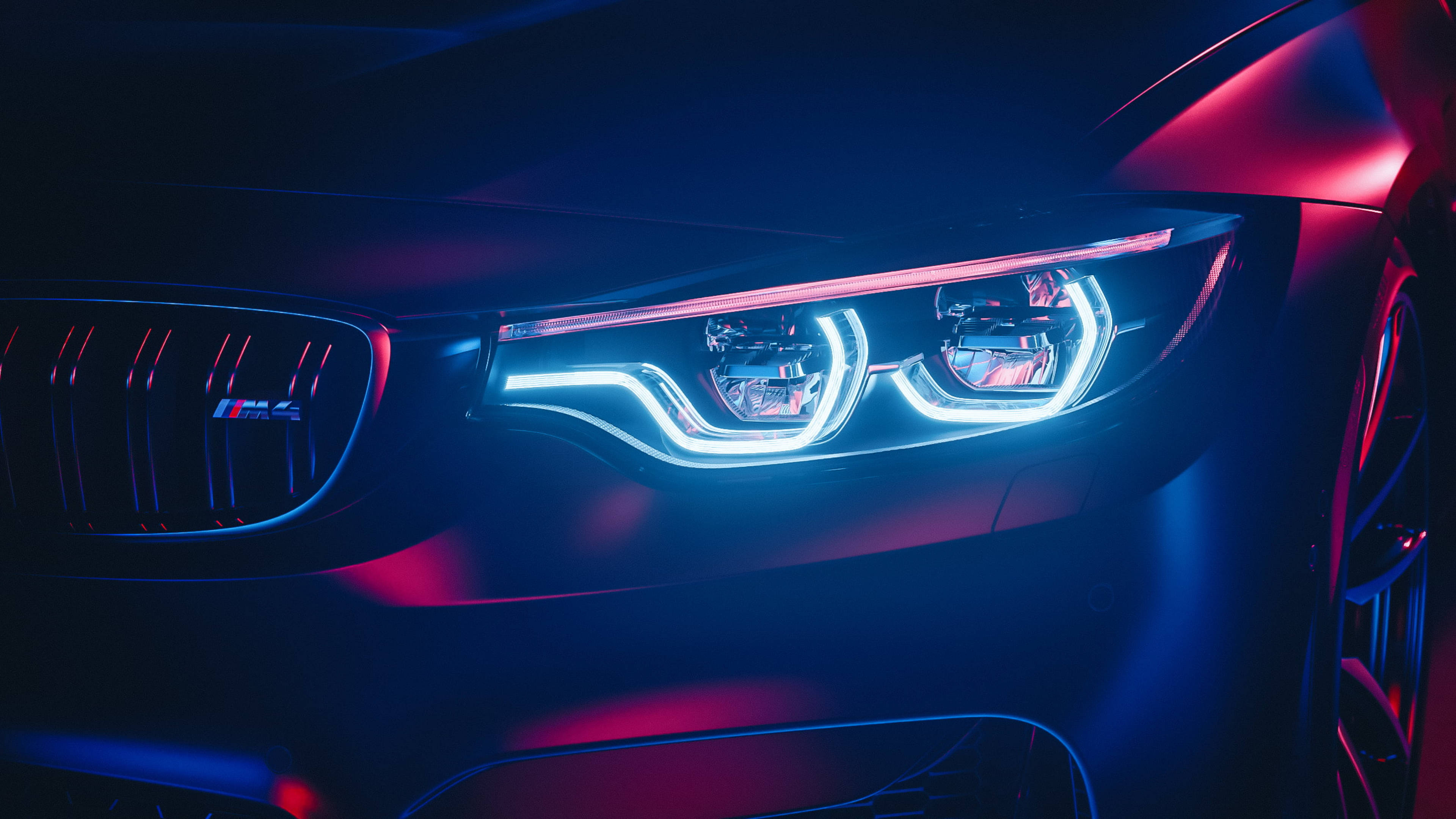 Ближній план яскравих фар BMW M4 Шпалери