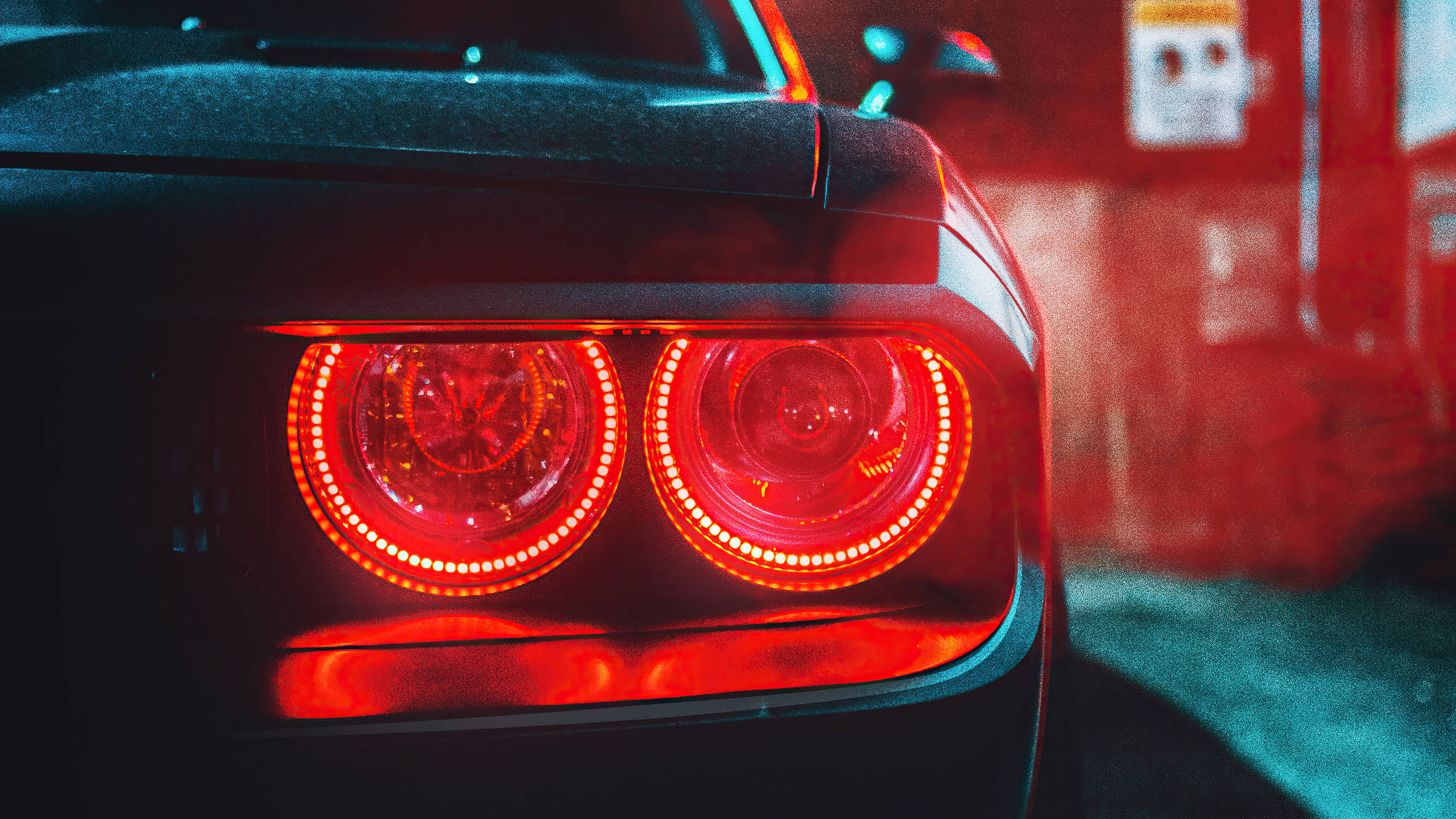 Сила та елегантність — чорний Dodge Challenger Demon 4K з яскравими червоними задніми ліхтарями. Шпалери