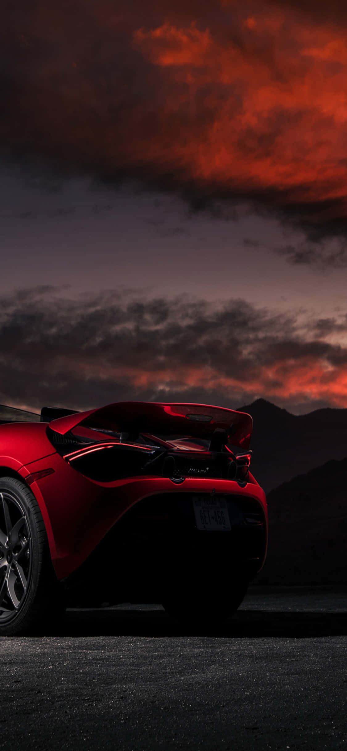 Фон iPhone X McLaren 720s Красный закат Шпалери