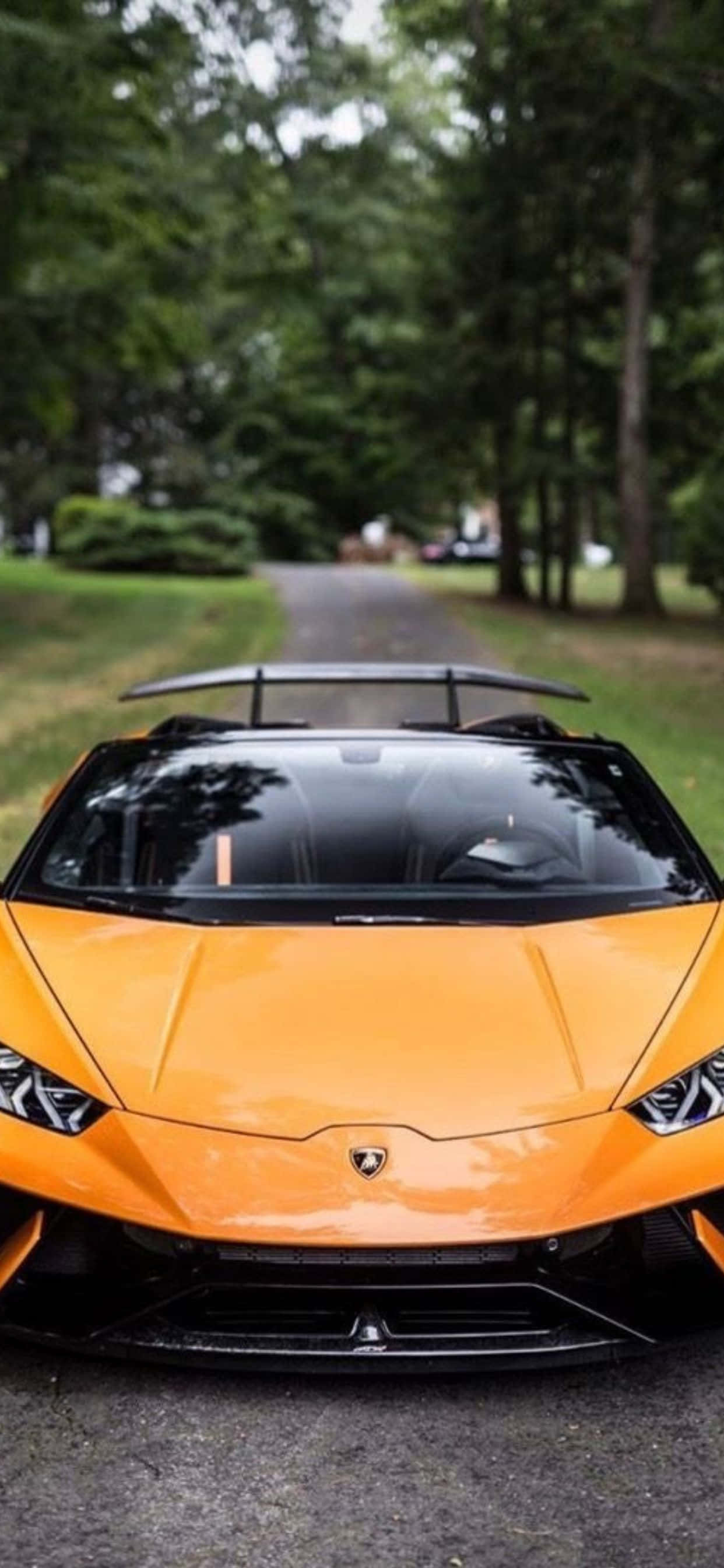 iPhone XS Max Lamborghini чорний і оранжевый фон Шпалери