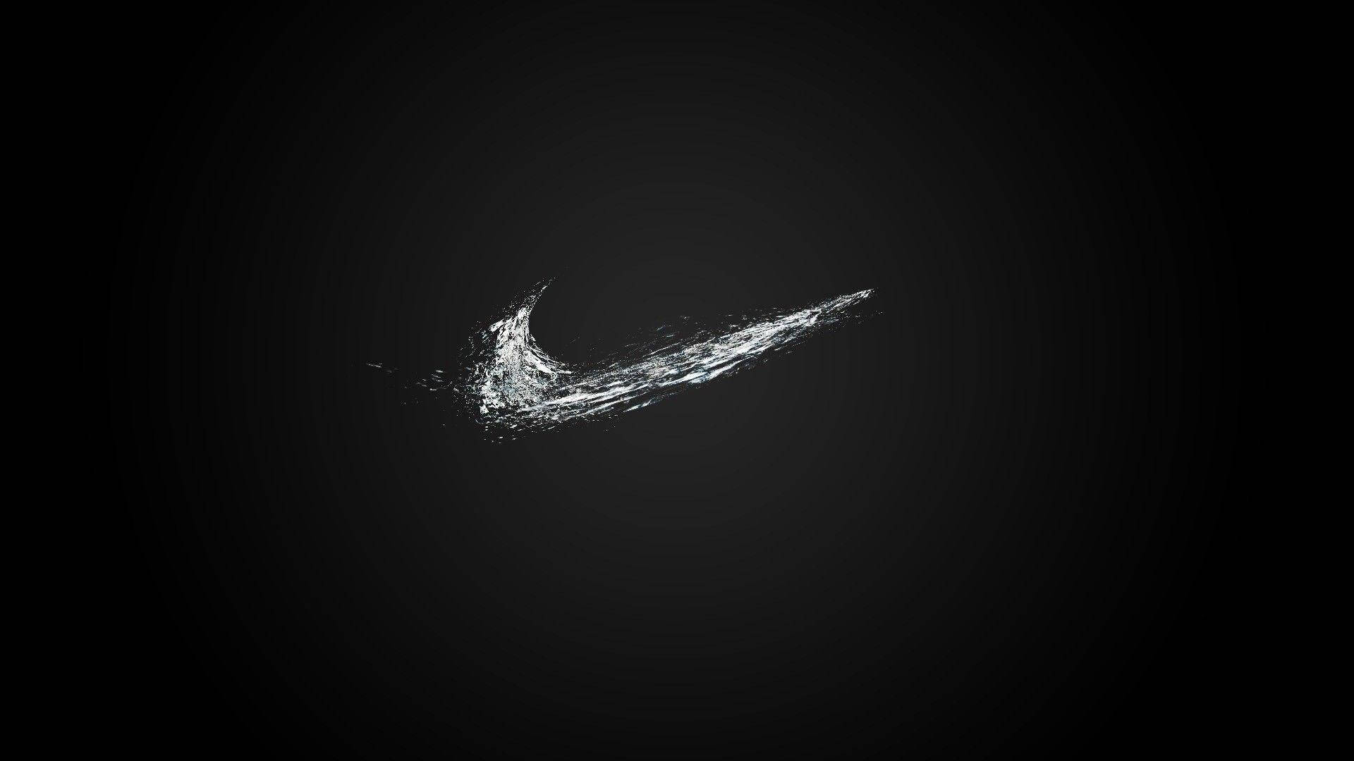 Простий логотип Nike крутий чорний чоловічок дивиться на комп'ютер Шпалери
