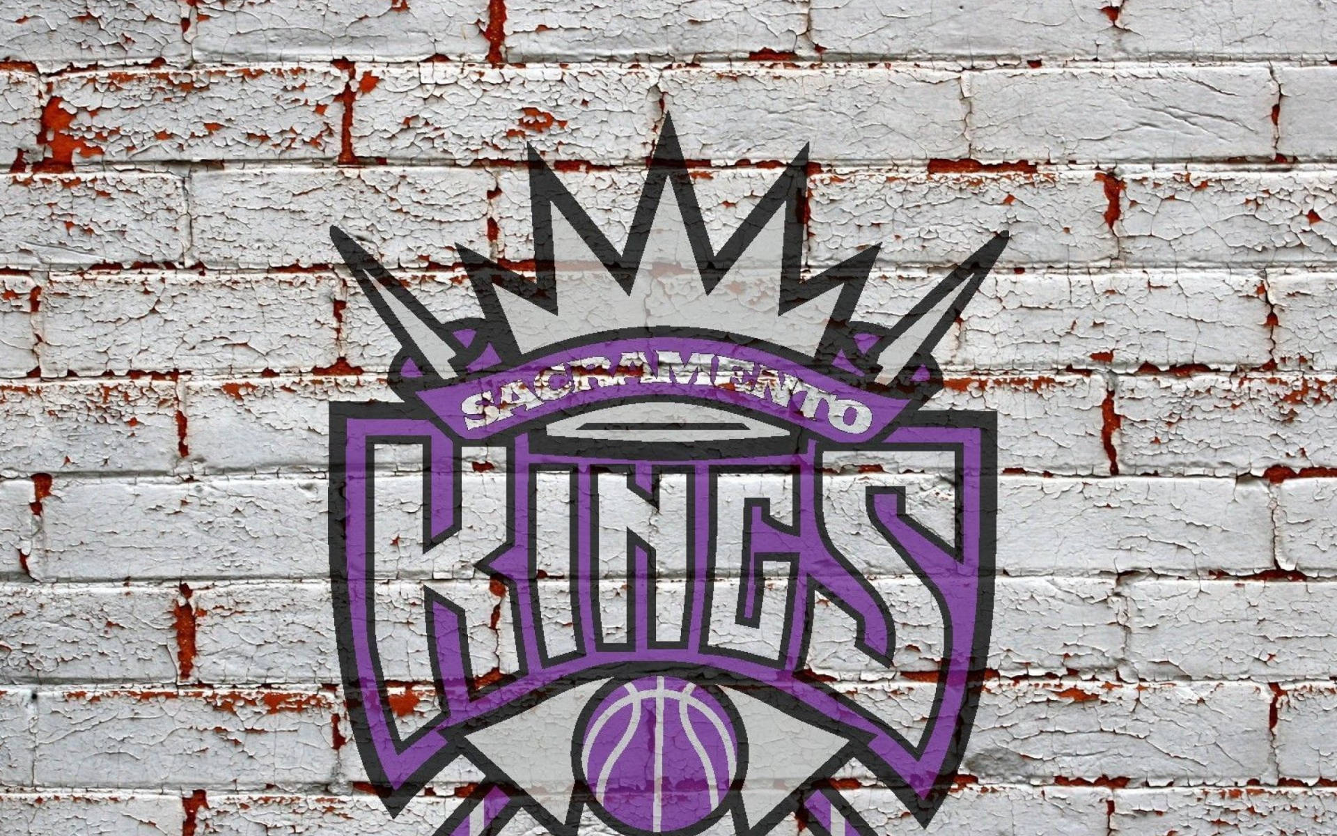 Логотип Sacramento Kings на кирпичной стене Шпалери