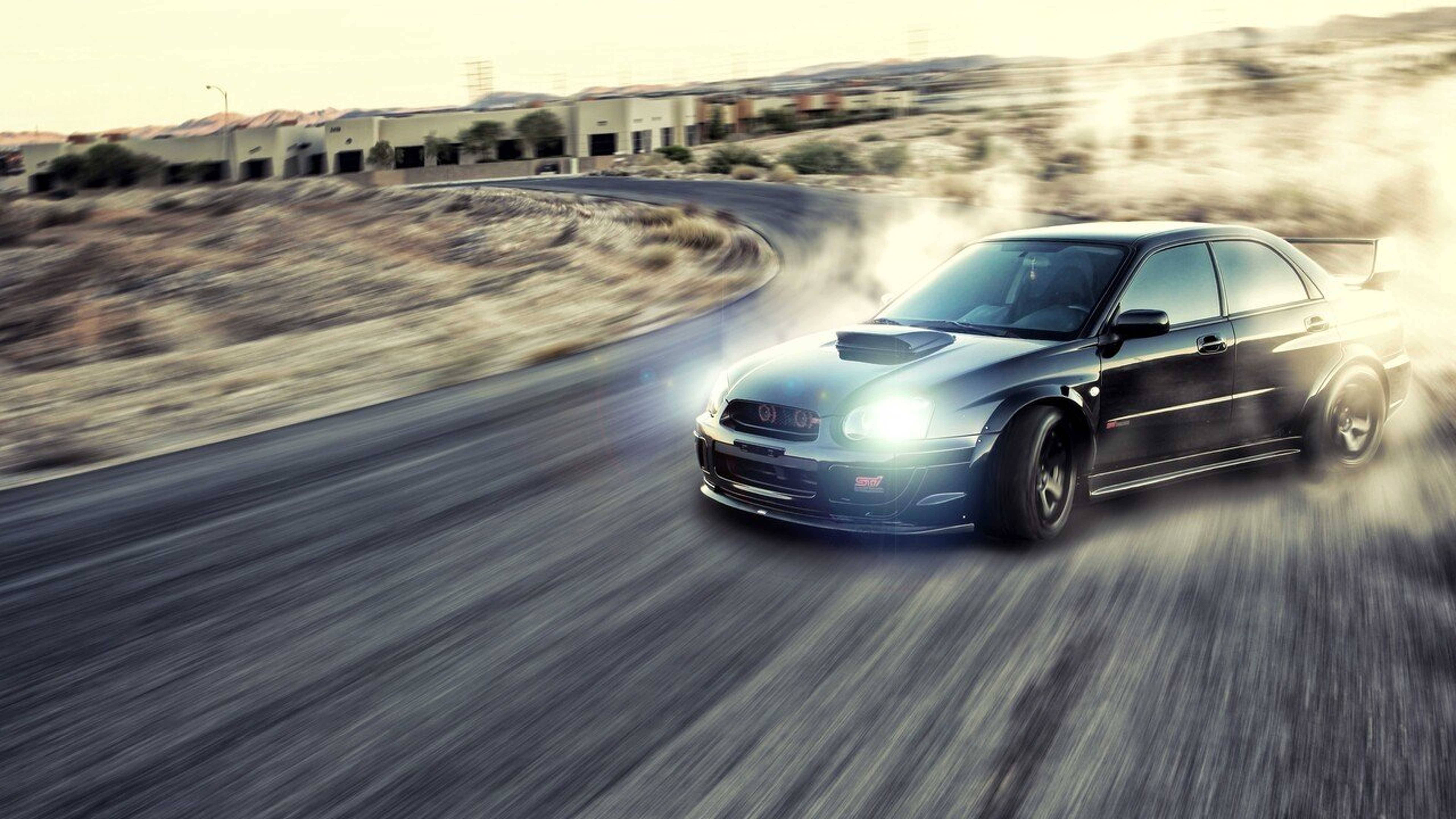 Ревучий дрифтовий автомобіль Subaru Impreza WRX у дії Шпалери