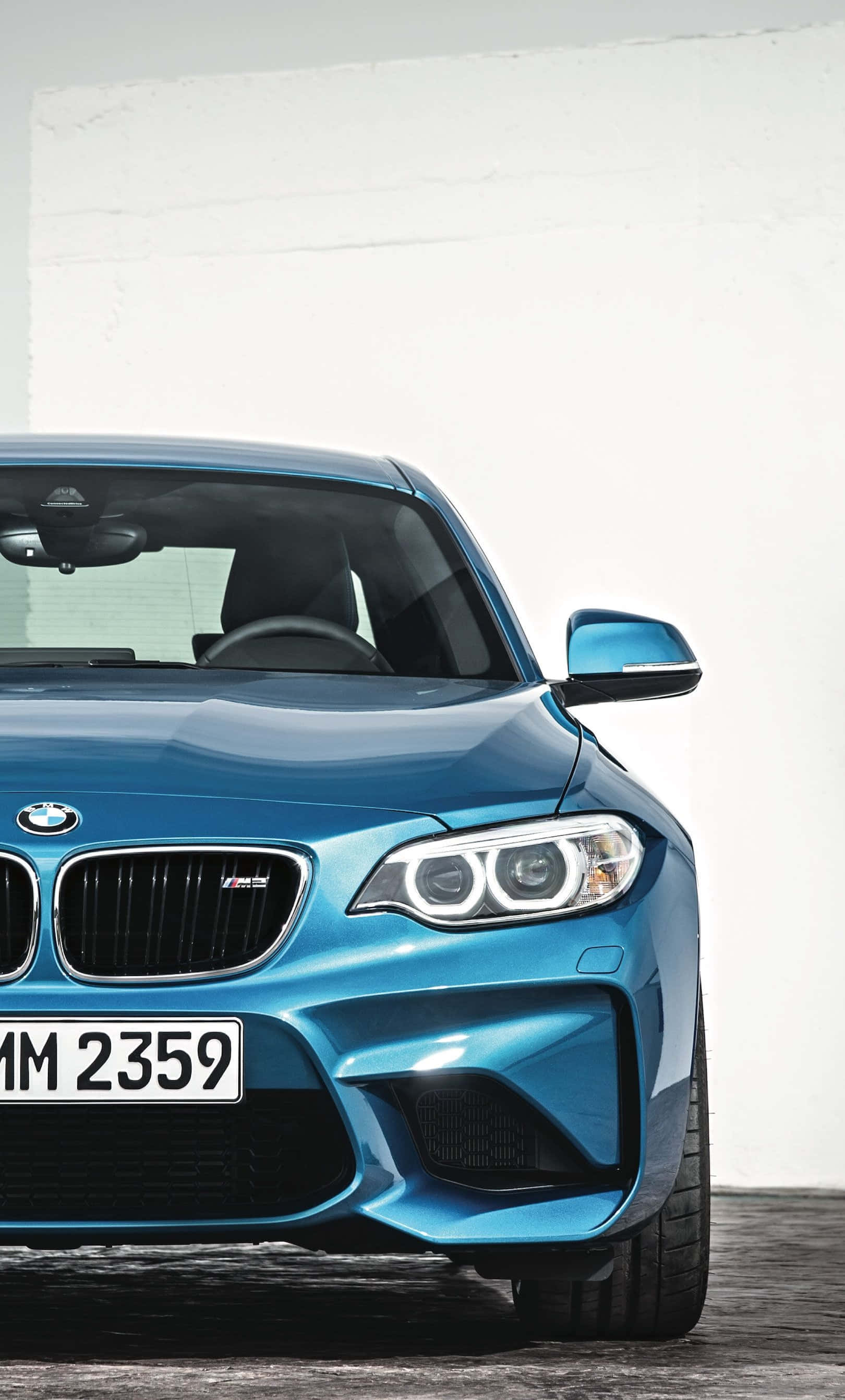 Стильна BMW шпалера для iPhone з елегантним спортивним авто та логотипом Шпалери