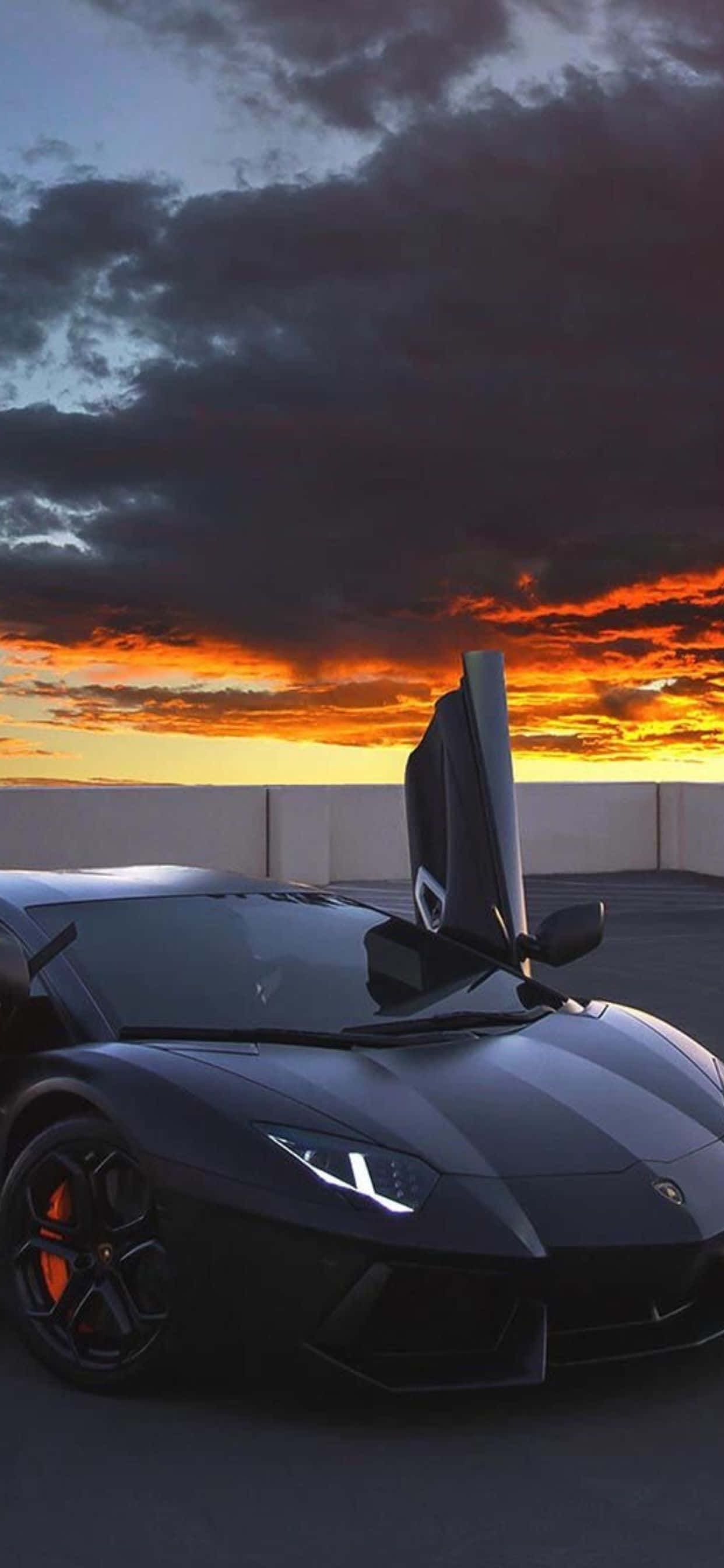 iPhone XS Max на фоне Lamborghini Aventador чёрного кольору Шпалери
