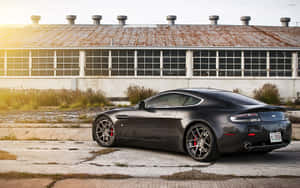 Aston Martin Vanquish в действии на живописной дороге — Steam Deck OLED Шпалери