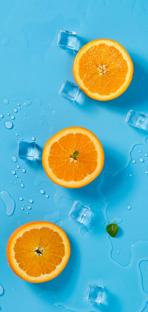 Обои Oneplus Oranges And Ice — iPhone 15 Шпалери